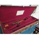 A leather covered case for a pair of shotguns, retailed by Atkin, Grant & Lang Ltd, 83cm wide