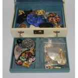 A jewellery case with costume jewellery