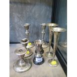 A collection of scrap silver items to include candlesticks, vases, etc