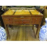 A 19th century continental inlaid kingwood dressing table or poudreuse, the hinged centre opening to