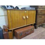 A 1960s oak and beech plywood sideboard designed by Alphons Loebenstein for Meredew, the doors