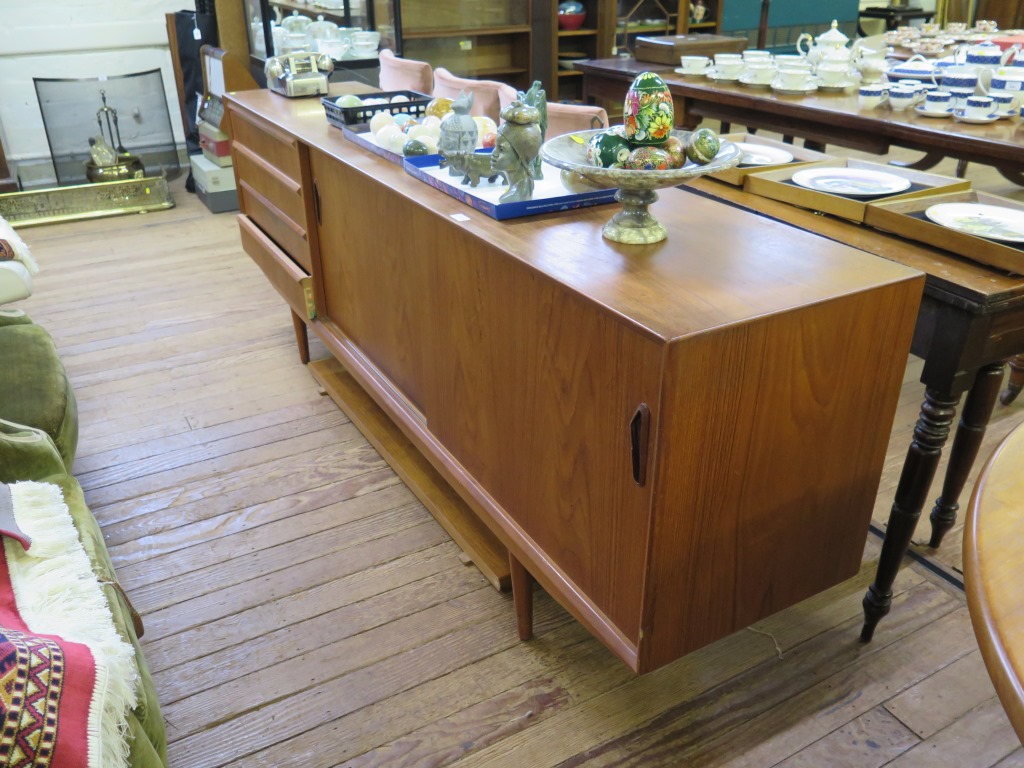 A 1970s teak dining room suite, comprising eight dining chairs, an extending dining table with two - Image 2 of 2