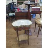 A French style kidney shaped marble top table, with giltmetal mounts, frieze drawer, and