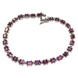 A pink sapphire and diamond line bracelet