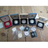 A collection of silver commemorative coins