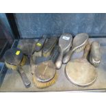 Two sets of silver ladies hand mirrors, brushes, etc