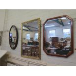 An oval wall mirror 75.5cm x 45.5cm, a rectangular giltwood wall mirror 93cm x 62cm, and two other