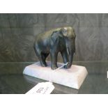 A bronze figure of an elephant, on a hardstone base, 10cm high