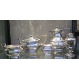 A four piece plated tea set and a sugar castor