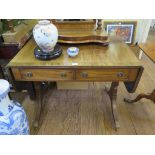 An early 19th century style mahogany sofa table, the ebony lined top over two frieze drawers on