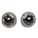 A pair of black pearls and diamond earrings