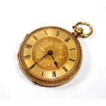 An 18 carat gold ladies key wind fob watch with decorative case and gold colour dial