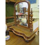 A Victorian mahogany toilet mirror, the arched glass on barley-twist supports on a shaped base