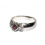 A white gold ring set with diamonds and ruby