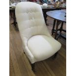 A late Victorian stained beech nursing chair, the button back and padded seat on turned tapering