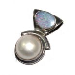 An opal and pearl pendant set in silver