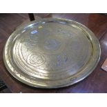 A large brass and silver inlaid Islamic plater