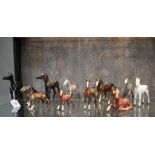 Two Beswick figures of black and white foals, two Beswick figures of Shetland ponies, five other