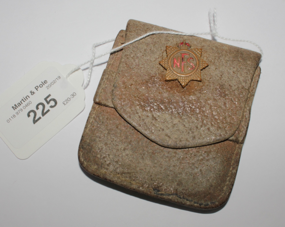 A World War II national fire service badge and wallet with warrant