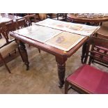 An Edwardian walnut windout dining table, with canted top on ring turned legs and castors, no