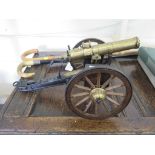 A brass model of a 1885 Gatling gun and carriage, 38cm long