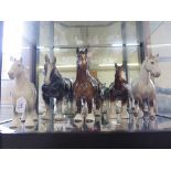 A Beswick figure of a grey shire horse 21cm high, two other Beswick horses and two other figures