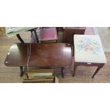An Edwardian inlaid piano stool with hinged seat and turned tapering legs on club feet, and a