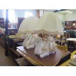 A pair of Spanish white ceramic and gilded table lamps, in the form of seated camels 31cm high (plus