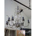 A brass and crystal nine light chandelier