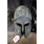 A bronze helmet, in the Ancient Greek style, 17cm high