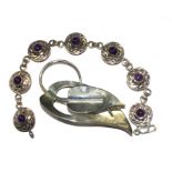 A silver leaf brooch together with an amethyst set silver bracelet