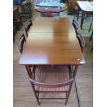 A Danish style 1950s rosewood extending dining table with two folding leaves, on turned legs, 91cm
