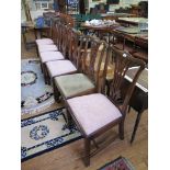 A set of six George III style mahogany dining chairs, the shaped top rails over pierced vase shape