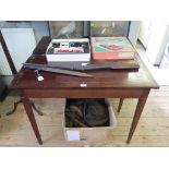 A cross-banded mahogany foldover tea table, boxwood and ebony strung frieze on square section