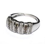 A white gold colour metal ring set with white colour diamonds