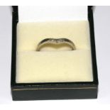 A diamond set white colour metal wish bone ring