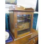 A circa 1910 oak glazed cabinet, 40.5cm high