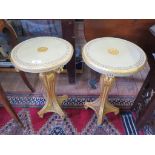 A pair of continental circular occasional tables, painted green and gilded with fluted cabriole