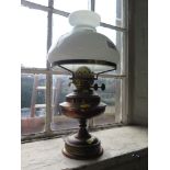 A brass and copper oil lamp with opaque glass shade, 48cm high