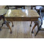 *A George II walnut foldover card table, with concertina action legs, the rectangular top with