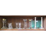 A collection of five pairs of various cut glass candlesticks