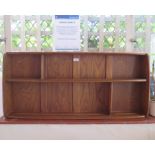 An Ercol style oak wall unit 106.5cm wide