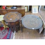 An early 20th century carved softwood octagonal occasional table, the top depicting a dragon, on
