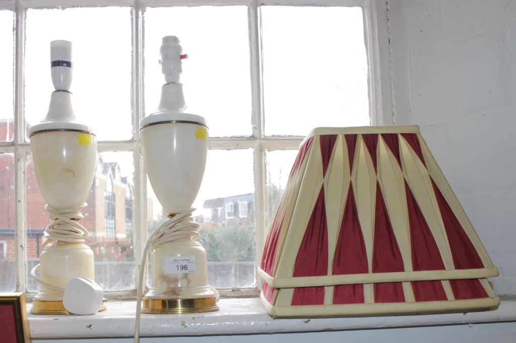 A pair of white hardstone vase shape table lamps, 30cm high and a brass desk lamp (3)