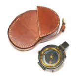 A World War I brass compass by W.H. Steward Ltd, with mother of pearl dial, 5cm diameter, with a