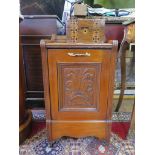 An Edwardian walnut purdonium with scroll carved panel and gilt handles 63cm high