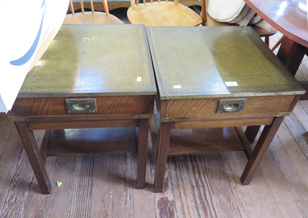 A pair of mahogany reproduction coffee tables, with leather tops and brass edging over frieze