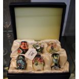 A set of six miniature Moorcroft vases, 5.5cm high, all in a single case