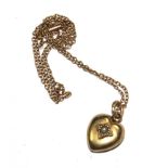 A pearl set heart pendant on gold neck chain