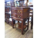 A pair of reproduction mahogany serpentine bedside cabinets by Brights of Nettlebed, each with two